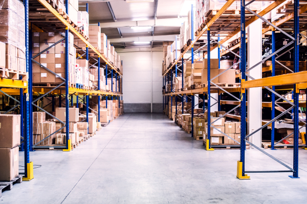 Shelves full of boxes in a warehouse.