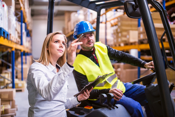 Young workers working together in a warehouse.