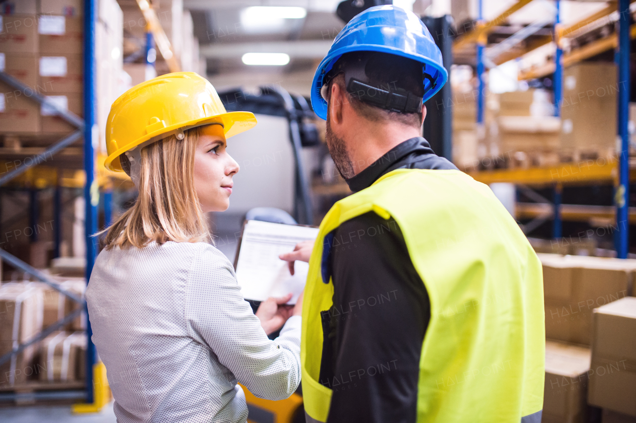 Young workers working together in a warehouse.