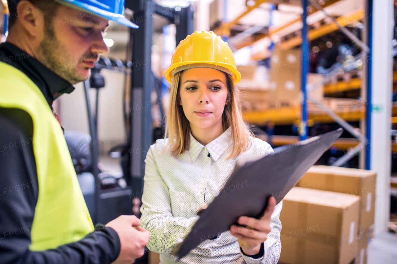 Young workers working together in a warehouse.