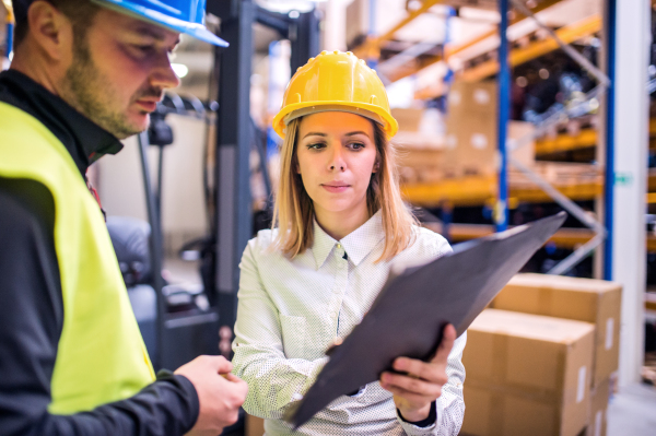 Young workers working together in a warehouse.