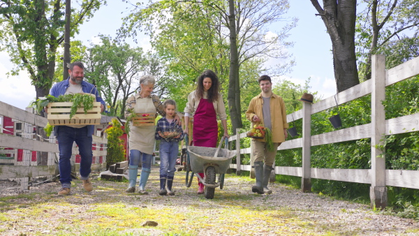 A large group of community farmers walking towards camera. Community farming concept.