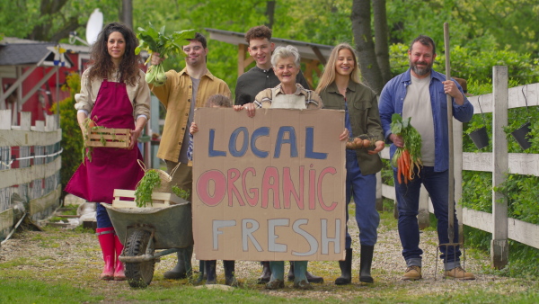 A large group of community farmers protesting with signs. Community farming concept.