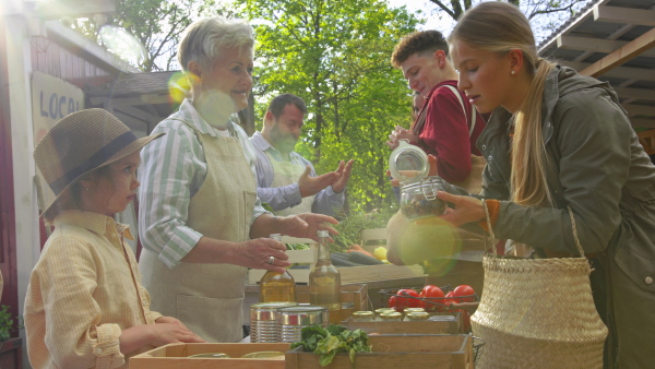 A customers buying fresh herbs and vegetables on farm market. Community farming concept.