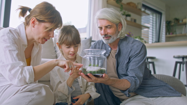 A beautiful family at home, sitting on floor and talking.