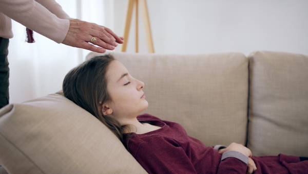 Professional healer doing treatment of small child, mental health concept.