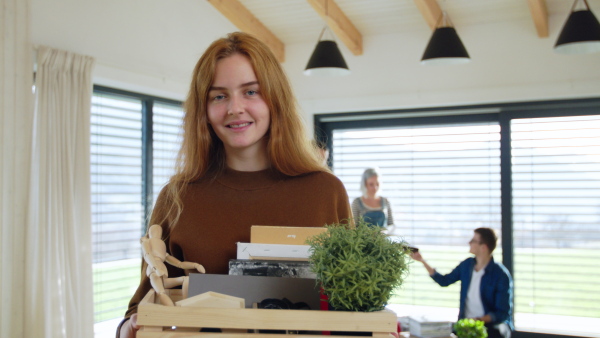 Group of cheerful young people moving in new home, house sharing concept.