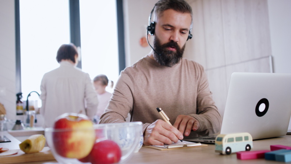 Father working at home and having work meeting. Homeoffice concept.