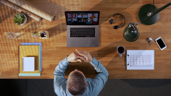 A top view of manager having a call with employees. Copy space.