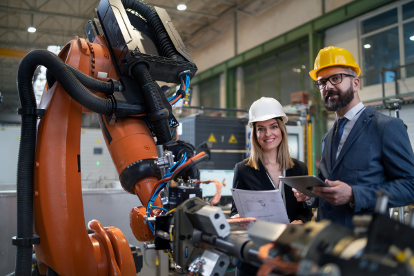 Female engineering manager and mechanic worker inside the factory