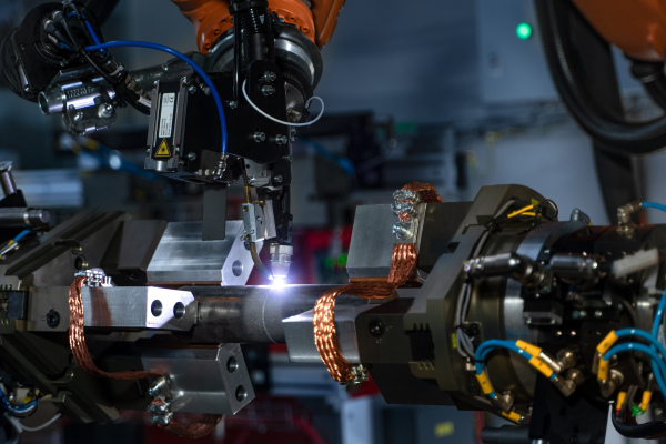 A robotic arm at industrial manufacture factory. Automated production cell.