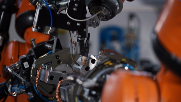 A robotic arm working in modern automobile factory.