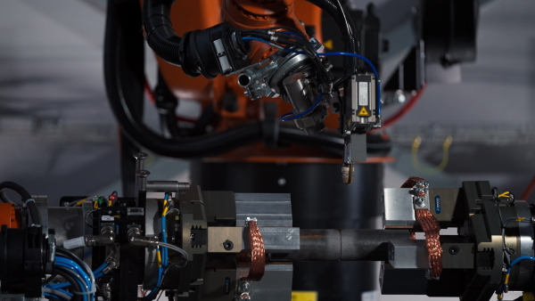 A robotic arm working in modern automobile factory.