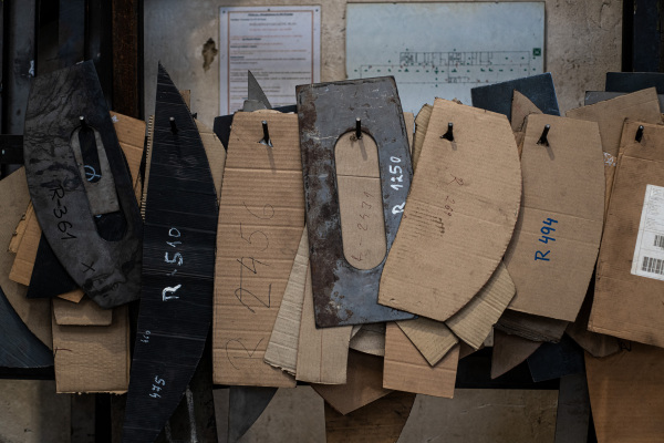 A close up of industrial products and cartoon models indoors in metal workshop.