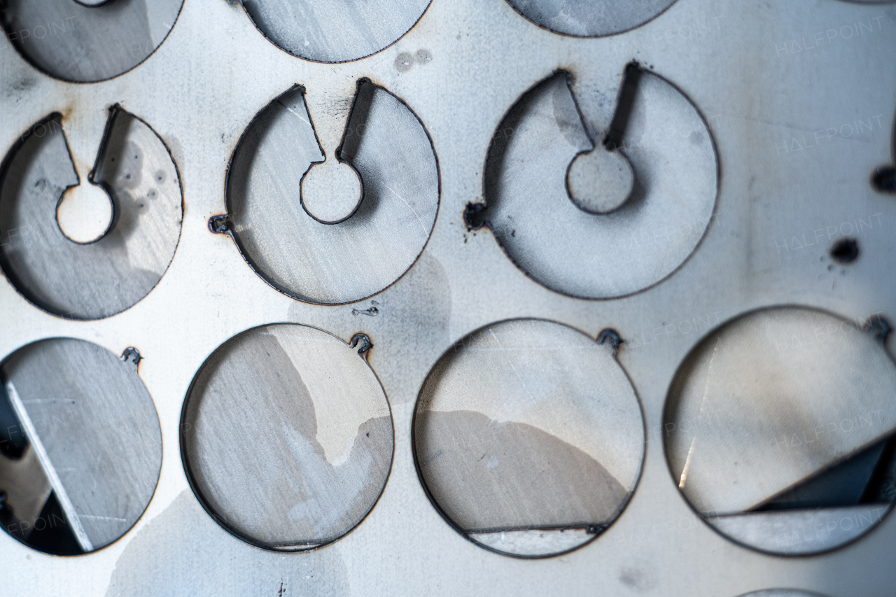 A close up of industrial products indoors in metal workshop.