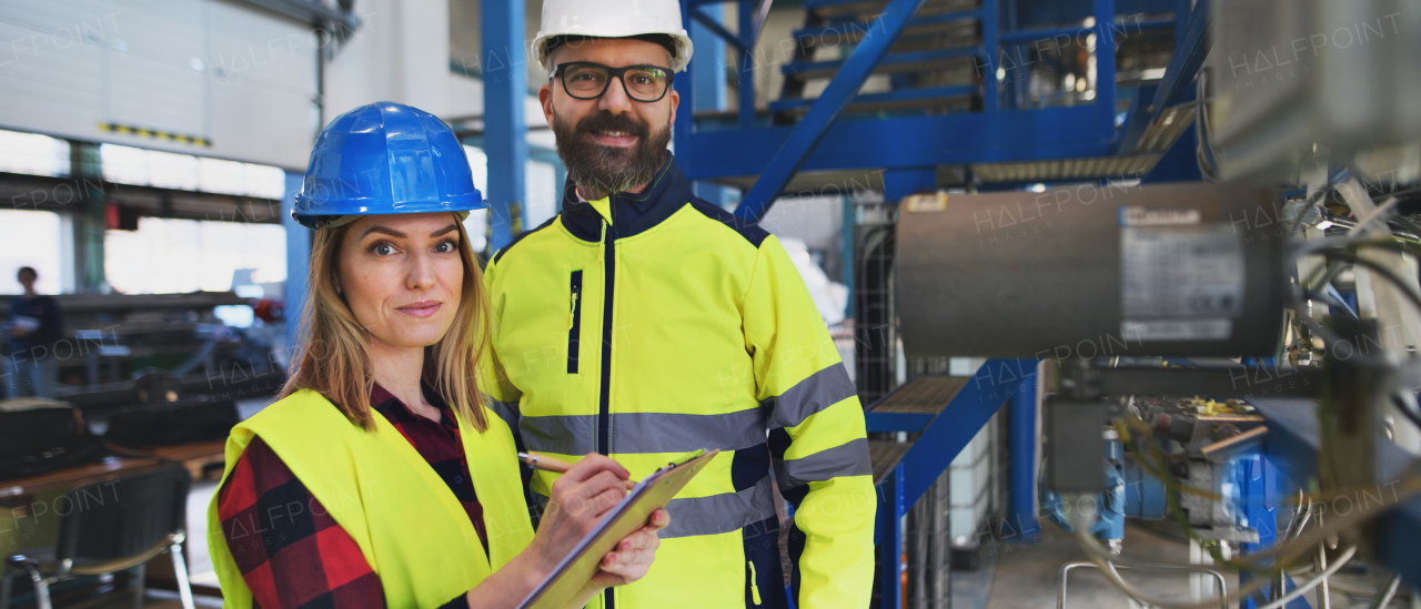 Female engineering manager and mechanic worker inside the factory