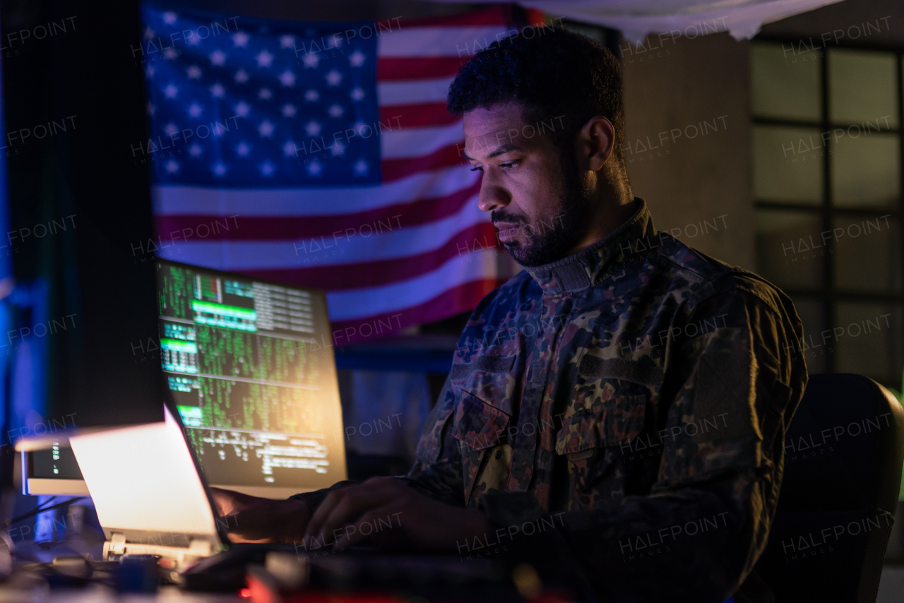 An American hacker in military unifrorm on dark web, cyberwar concept.