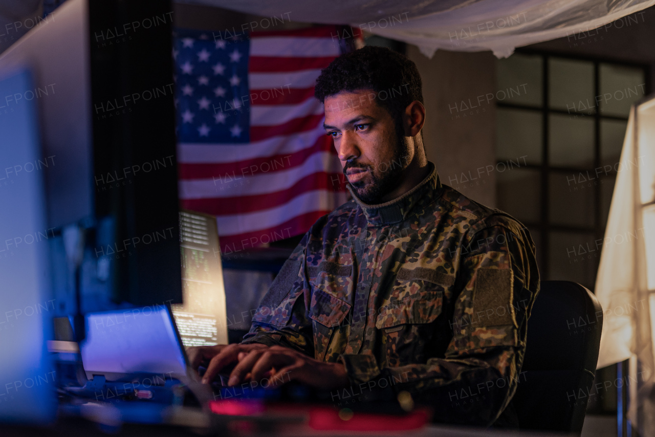 An American hacker in military unifrorm on dark web, cyberwar concept.