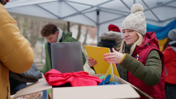 The volunteers distributing blankets and other donations to refugees on the Ukrainian border.