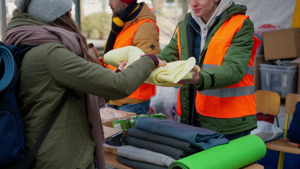 The volunteers distributing blankets and other donations to refugees on the Ukrainian border.