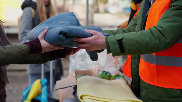 The volunteers distributing blankets and other donations to refugees on the Ukrainian border.