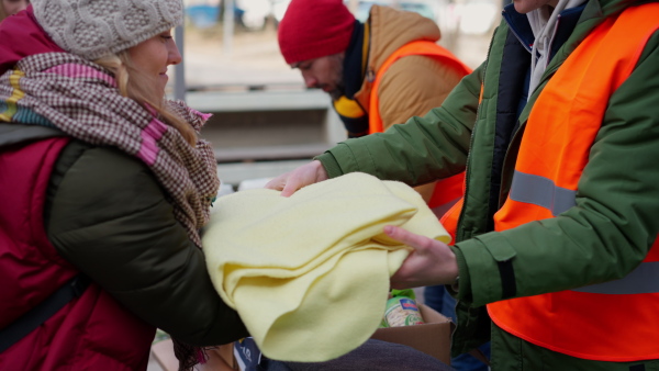 The volunteers distributing blankets and other donations to refugees on the Ukrainian border.