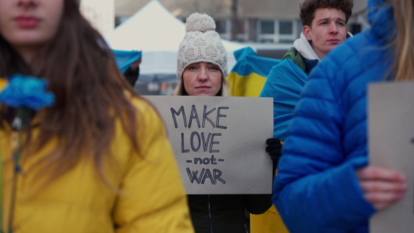 Protest against Russian invasion of Ukraine. People holding anti war sings and banners in the street.