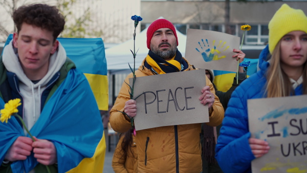 Protest against Russian invasion of Ukraine. People holding anti war sings and banners in the street.