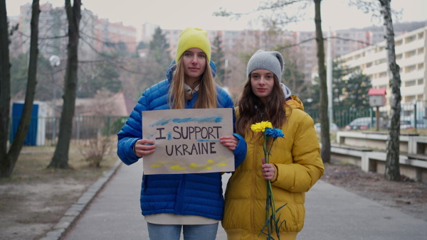 Protest against Russian invasion of Ukraine. People holding anti war sings and banners in the street.