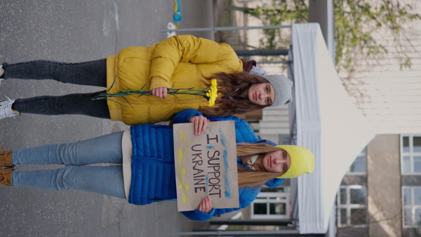 Protest against Russian invasion of Ukraine. People holding anti war sings and banners in the street.