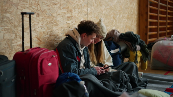 Ukrainian war refugees in a temporary shelter and help center.