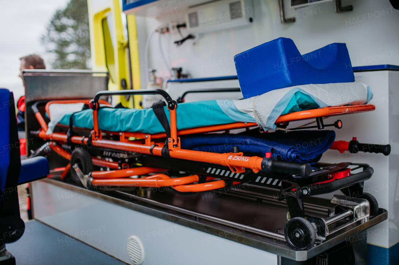 Close-up of empty stretcher inside of the ambulance car.