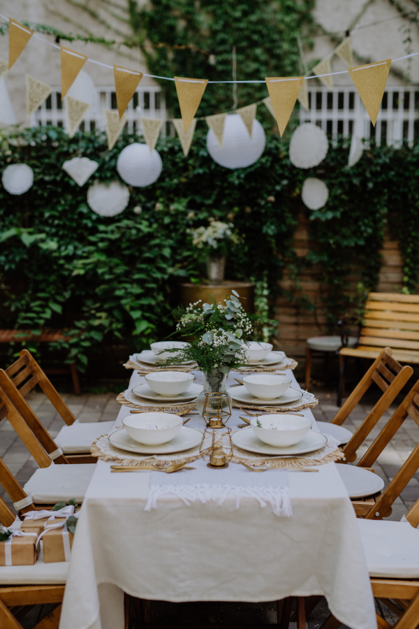 High angle view of setting wedding table with the flowers at backyard.