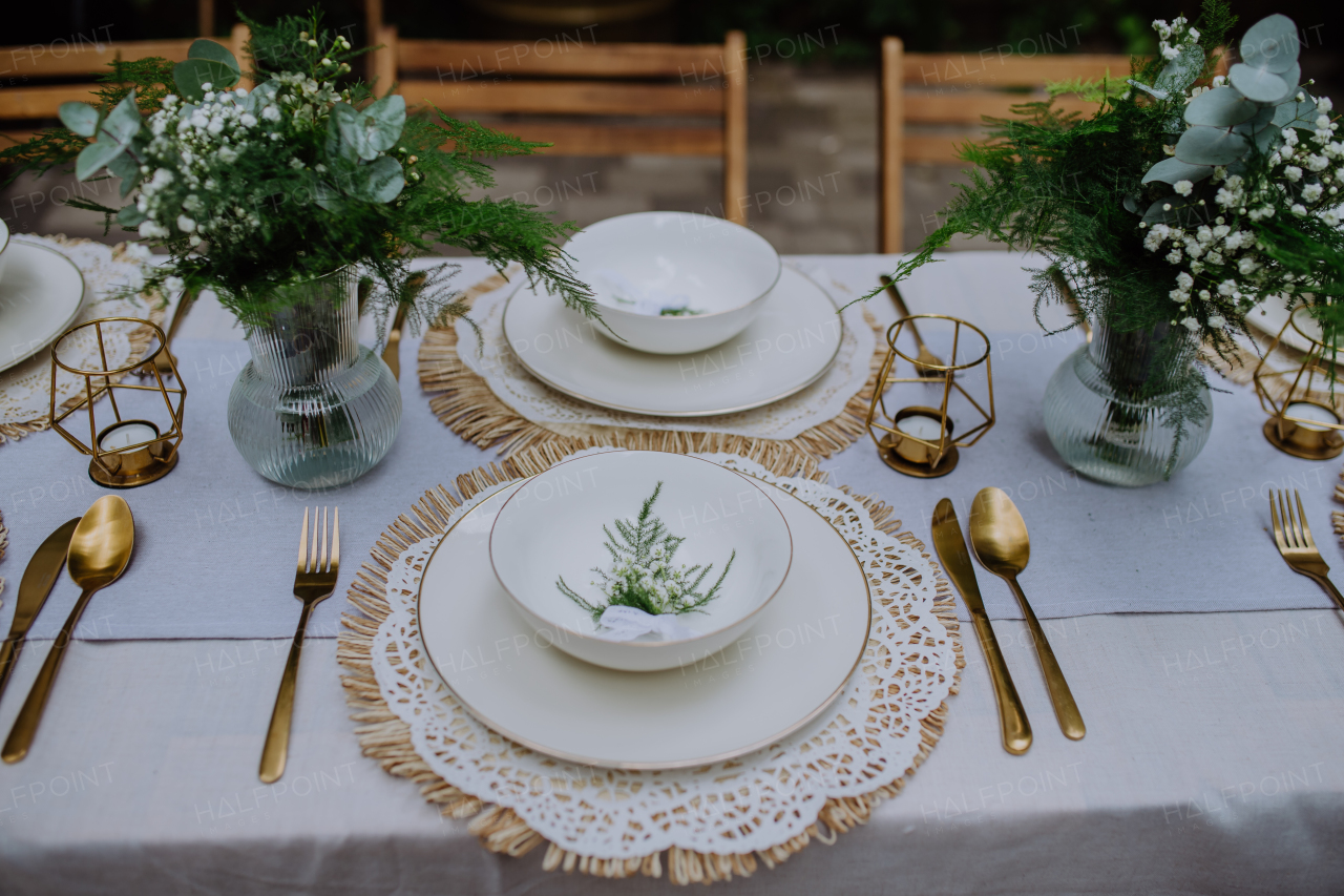 High angle view of aesthehic setting wedding table with the flowers at backyard.