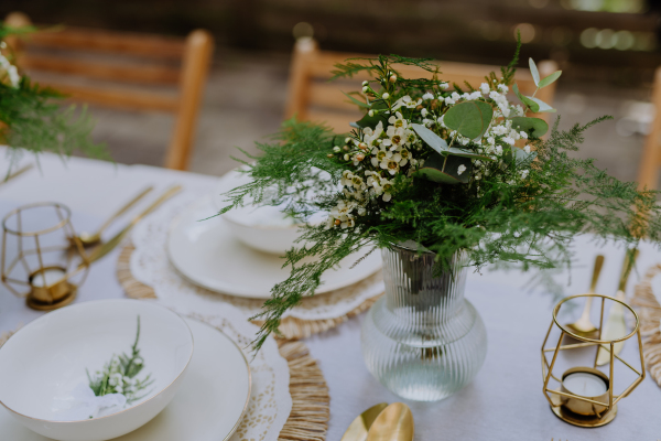 High angle view of aesthehic setting wedding table with the flowers at backyard.