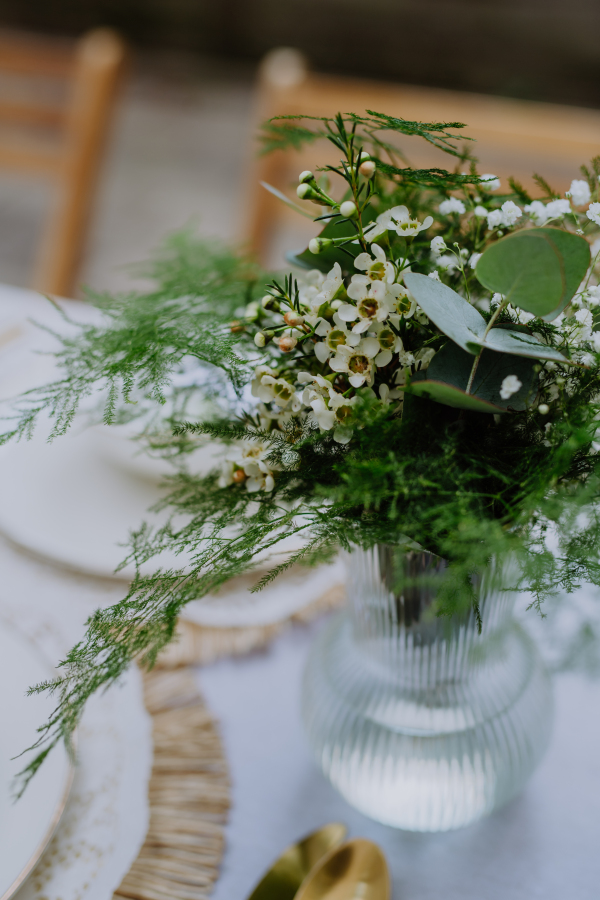 High angle view of aesthehic setting wedding table with the flowers at backyard.