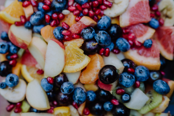 Close-up of a fruit dessert buffet at small wedding reception outside in the backyard.