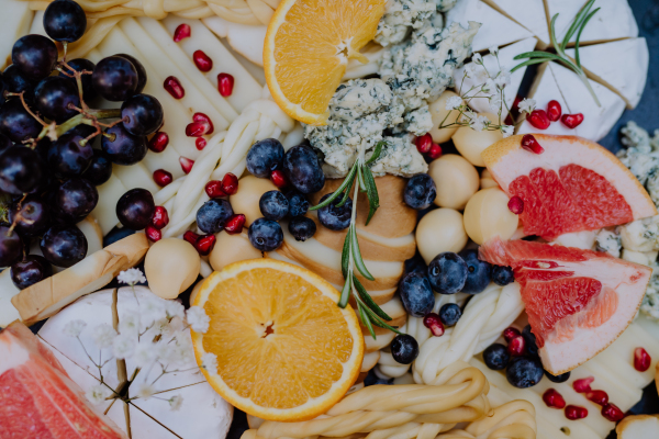 Close-up of a dessert buffet at small wedding reception outside in the backyard.