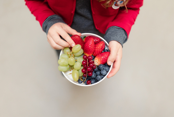 A top view of schoolchild having healthy lunch in school canteen.