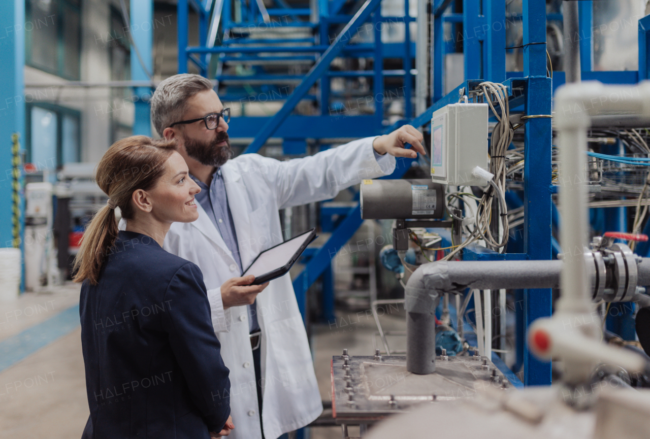 Engineering managers doing routine check up in industrial factory