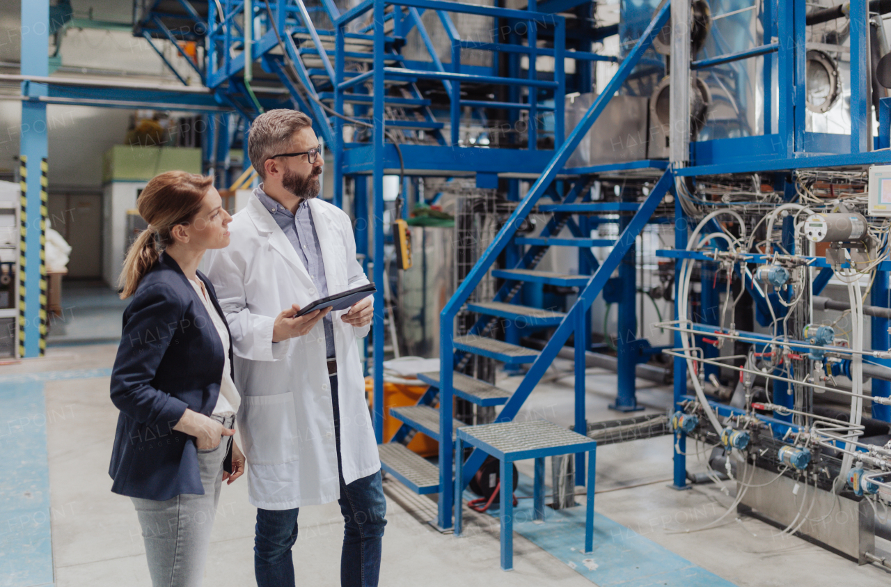 Engineering managers doing routine check up in industrial factory