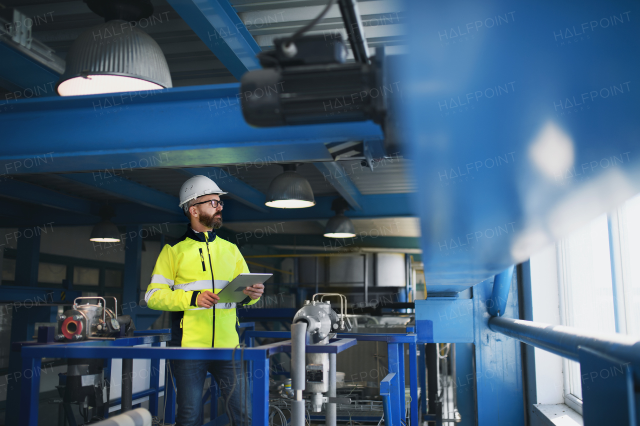 A portrait of engineer working in industrial factory