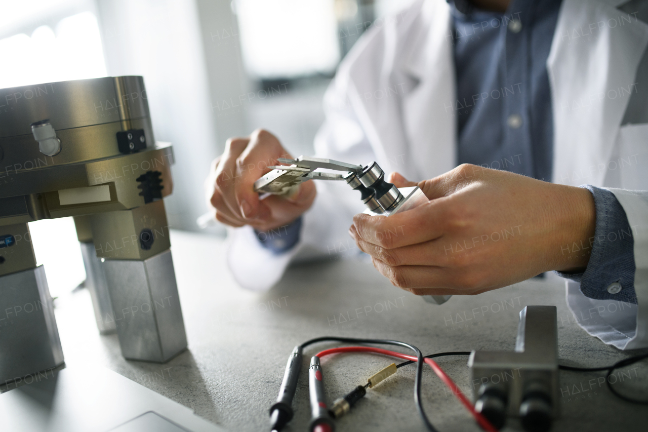 Close-up of an engineer man working in laboratory.