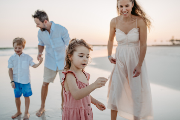 Happy family with little kids enjoying time at the sea in exotic country.