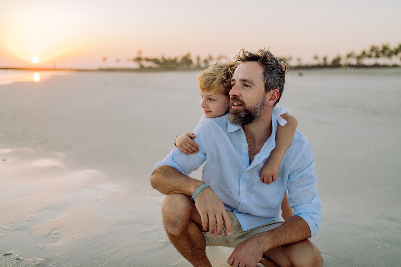 Father with his son enjoying together time at the sea.