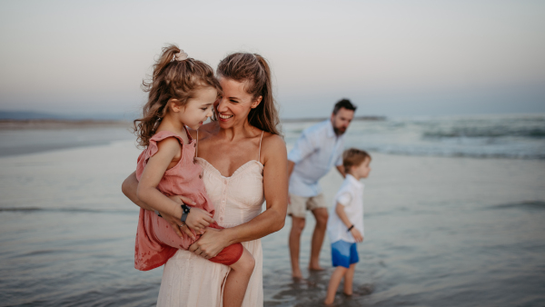 Happy family with little kids enjoying time at the sea in exotic country.