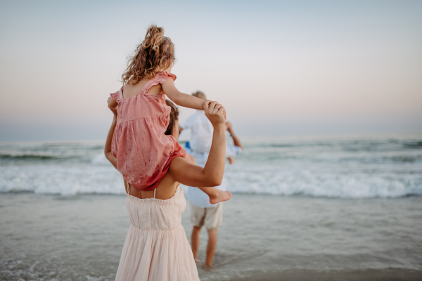 Happy family with little kids enjoying time at the sea in exotic country.