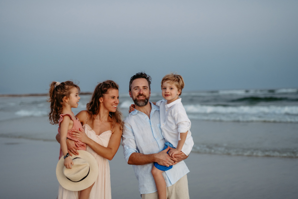 Happy family with little kids enjoying time at the sea in exotic country.