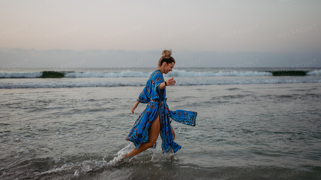 Young woman enjoying time at the sea.