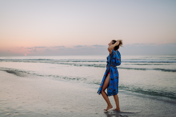 Young woman enjoying time at the sea.